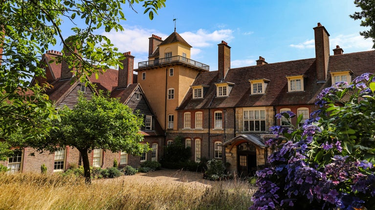 Standen pictured in high summer from the garden.